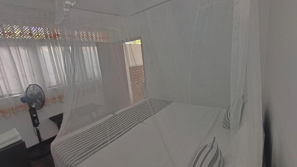Postel nebo postele na pokoji v ubytování Sunbeam Homestay