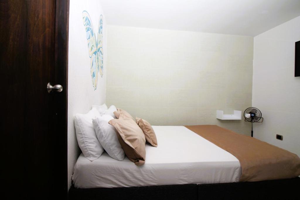 Postel nebo postele na pokoji v ubytování DAM Hotel Pereira