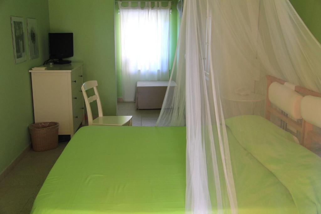 Postel nebo postele na pokoji v ubytování B&B La Rosa Dei Venti