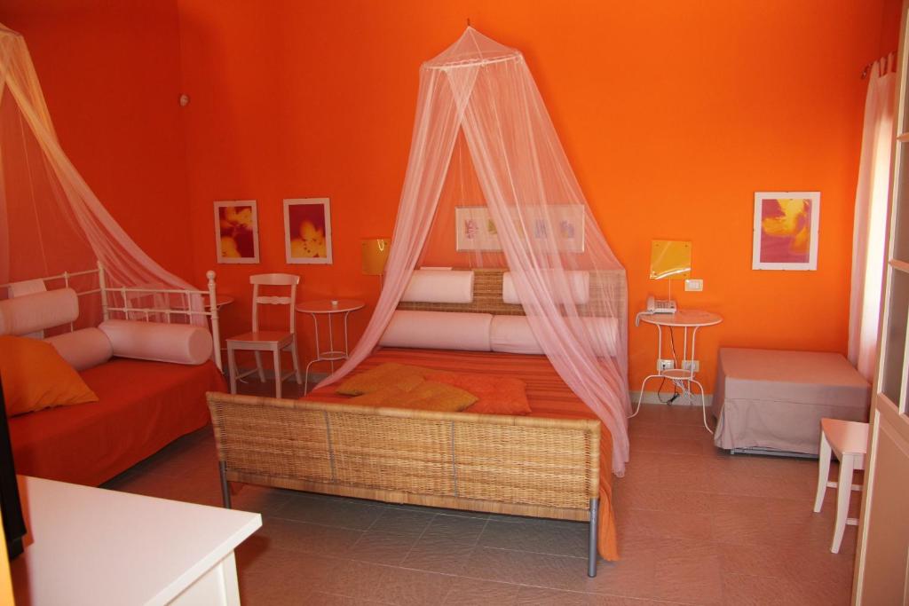 Postel nebo postele na pokoji v ubytování B&B La Rosa Dei Venti