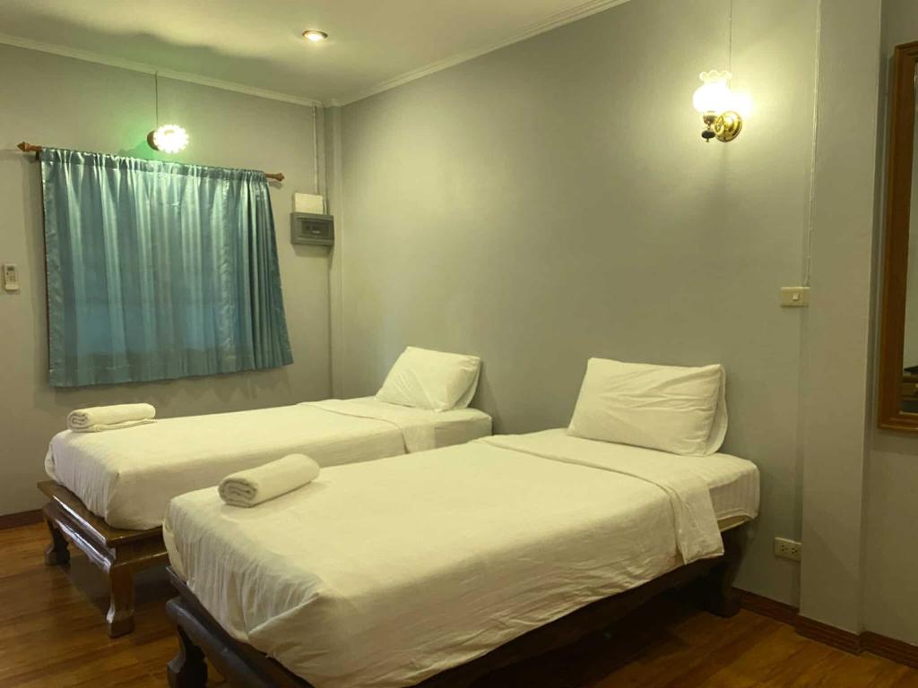 Postel nebo postele na pokoji v ubytování Old City Guest House