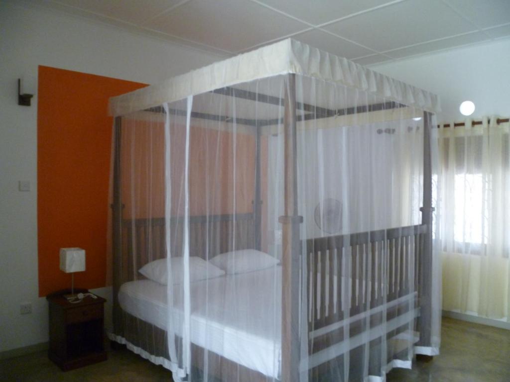 En eller flere senge i et værelse på Lucky Cottage