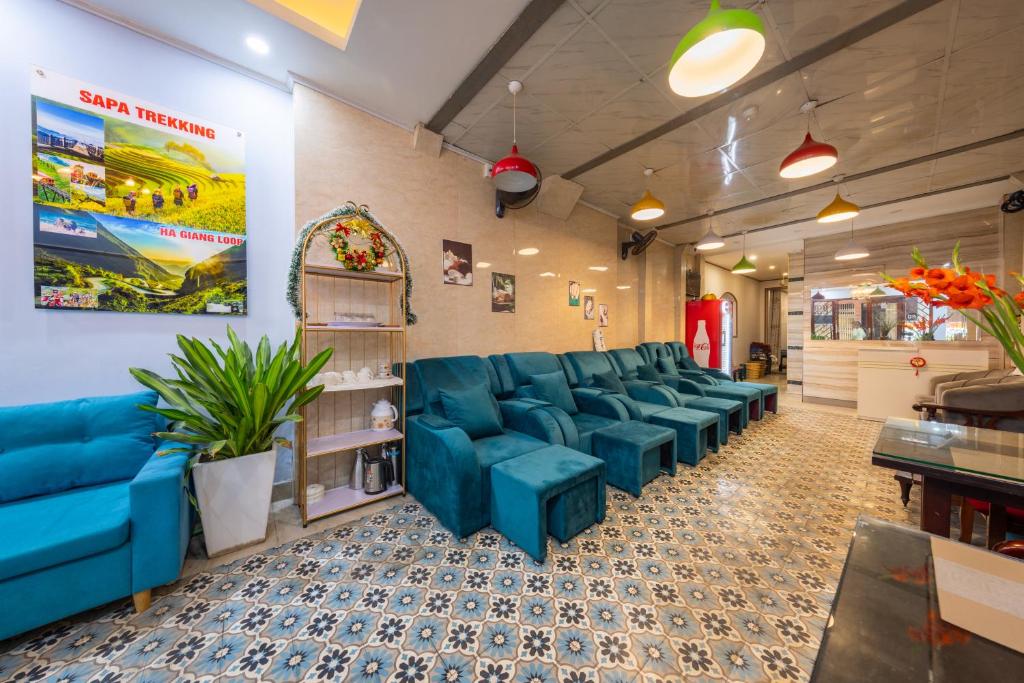 a waiting room with blue chairs in a store at Hanoi Capital Hotel & Spa in Hanoi