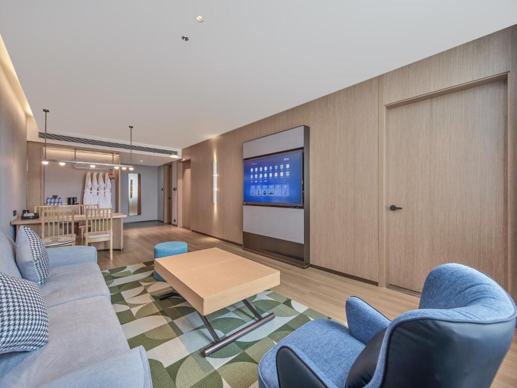 Una televisión o centro de entretenimiento en Country Inn&Suites By Radisson, Xi'an Bell and Drum Tower Flagship