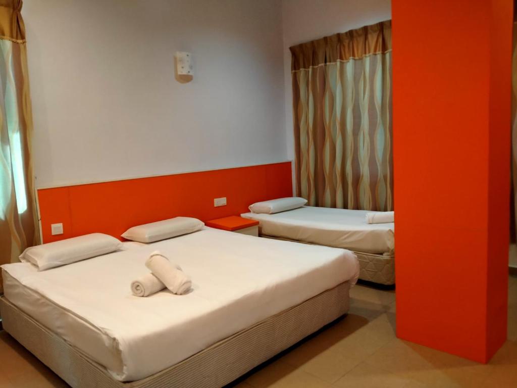 Postel nebo postele na pokoji v ubytování Akar Beach Resort