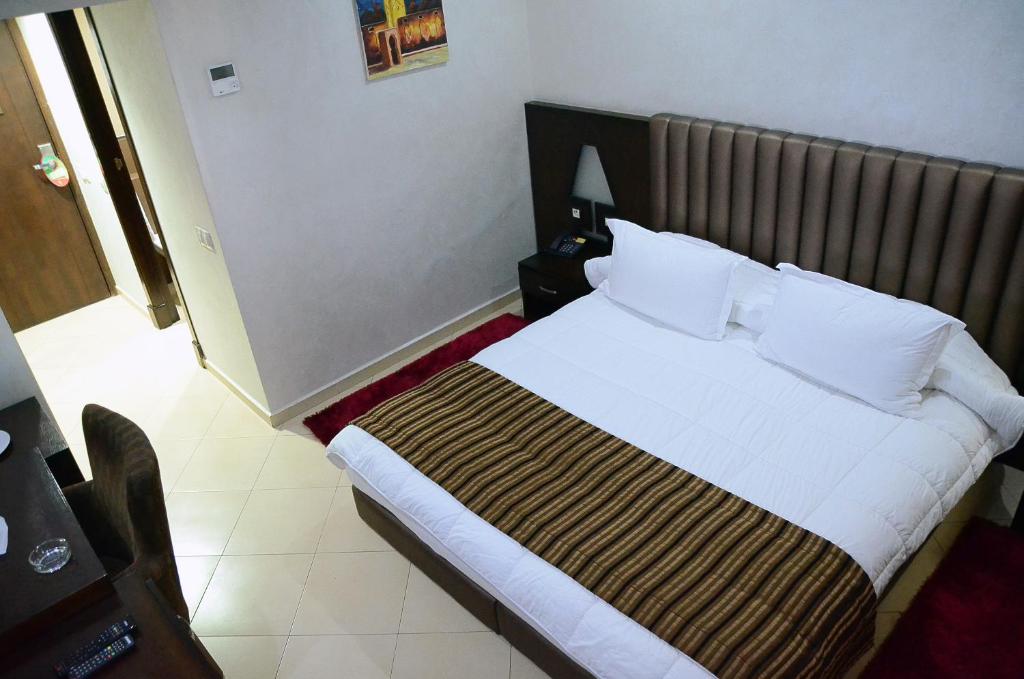 Postel nebo postele na pokoji v ubytování Hotel Chams