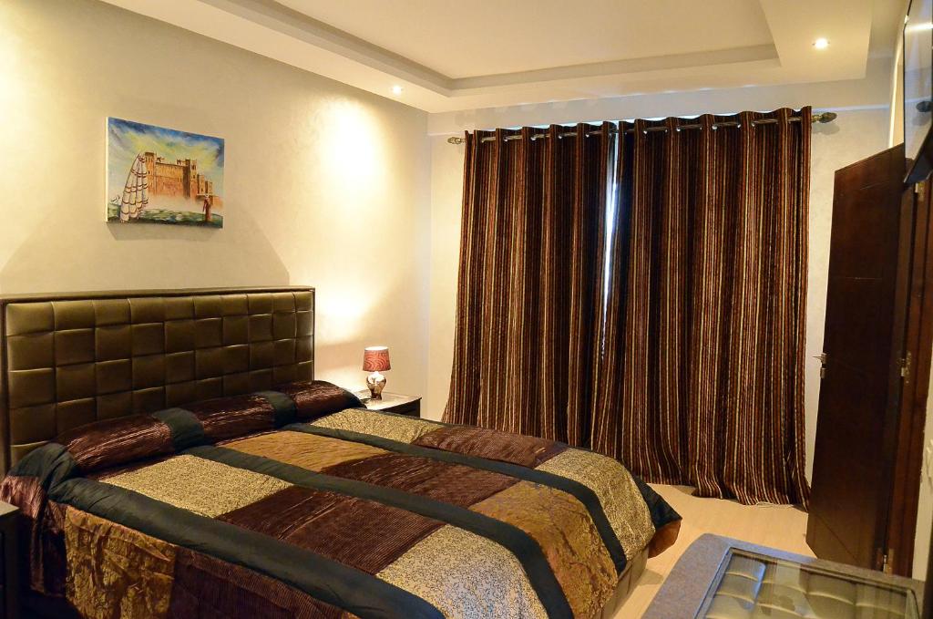 Postel nebo postele na pokoji v ubytování Hotel Chams