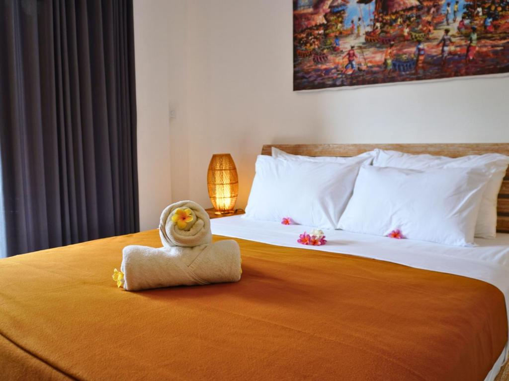 Postel nebo postele na pokoji v ubytování Summer of Surf Hostel Uluwatu