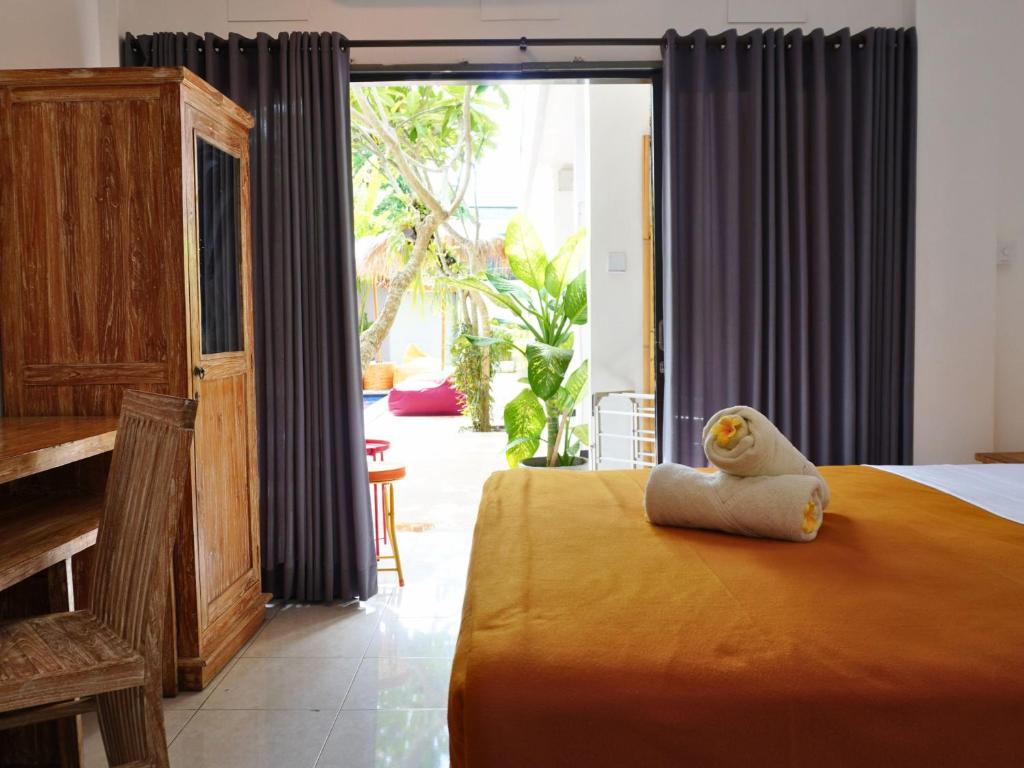 Postel nebo postele na pokoji v ubytování Summer of Surf Hostel Uluwatu