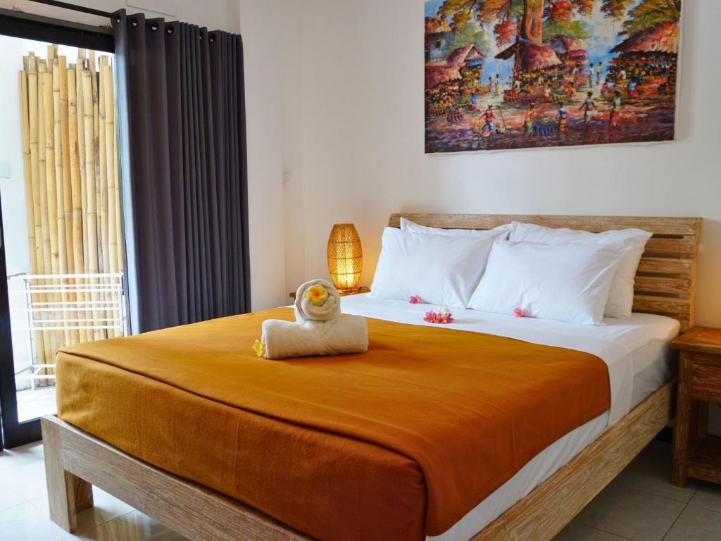 Postel nebo postele na pokoji v ubytování Summer of Surf Hostel Uluwatu