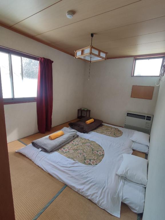 Postel nebo postele na pokoji v ubytování PEUF Lodge