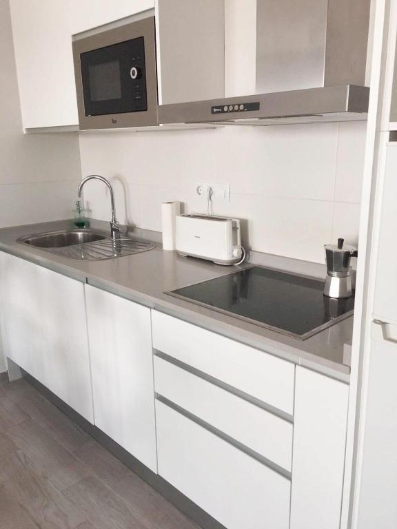 A kitchen or kitchenette at Calma apartment On the most amazing beach in Fuerteventura