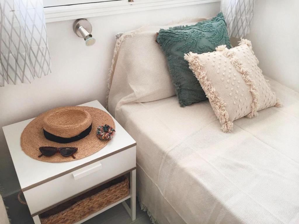 A bed or beds in a room at Calma apartment On the most amazing beach in Fuerteventura