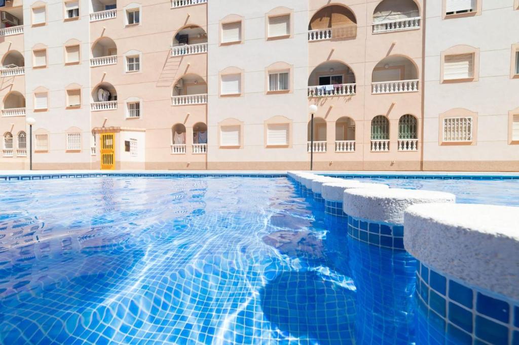 The swimming pool at or close to Cozy apartment in downtown area