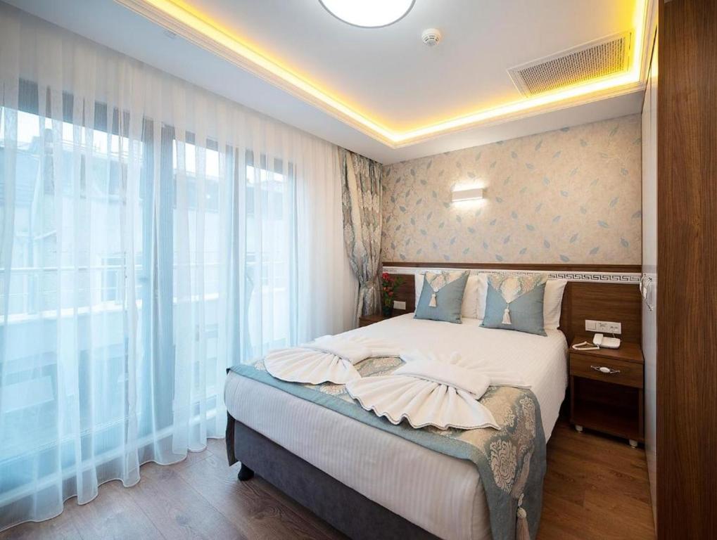 Postel nebo postele na pokoji v ubytování Room in Guest room - Lika Hotel - Superior Double or Twin Room - Luxury in Istanbul Center