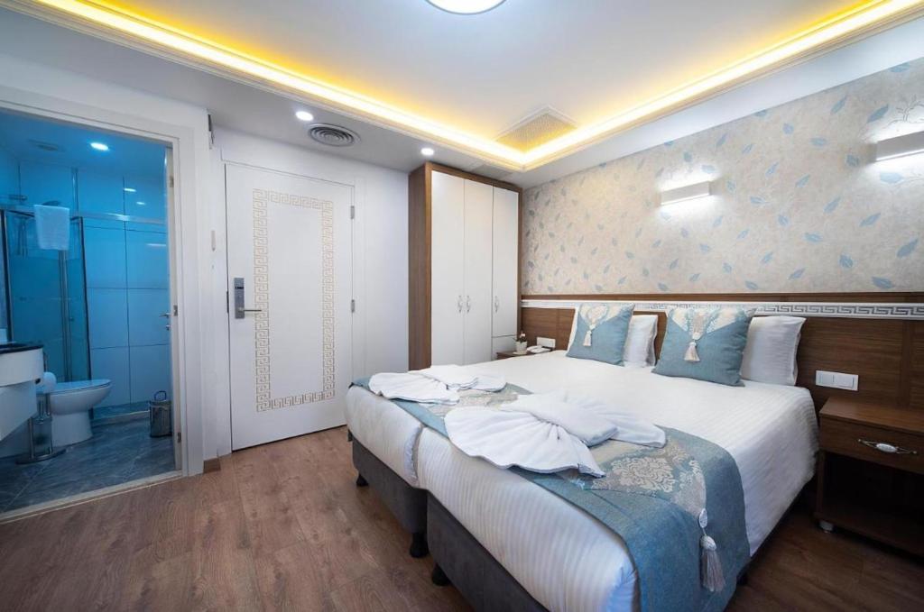 Postel nebo postele na pokoji v ubytování Room in Guest room - Lika Hotel - Superior Double or Twin Room - Luxury in Istanbul Center