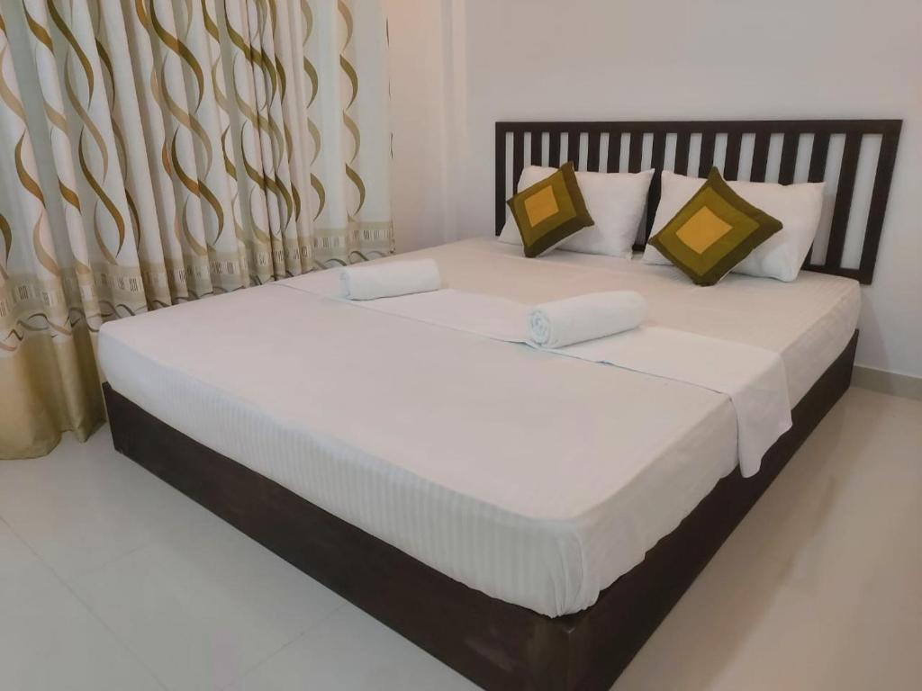 Postel nebo postele na pokoji v ubytování Nature Bird Paradise Hotel Sigiriya