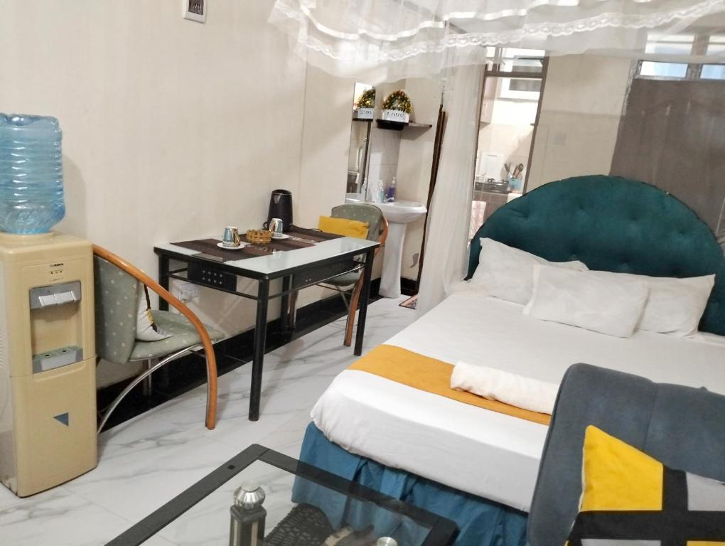 Postel nebo postele na pokoji v ubytování KANAPRIME-Studio Apartment