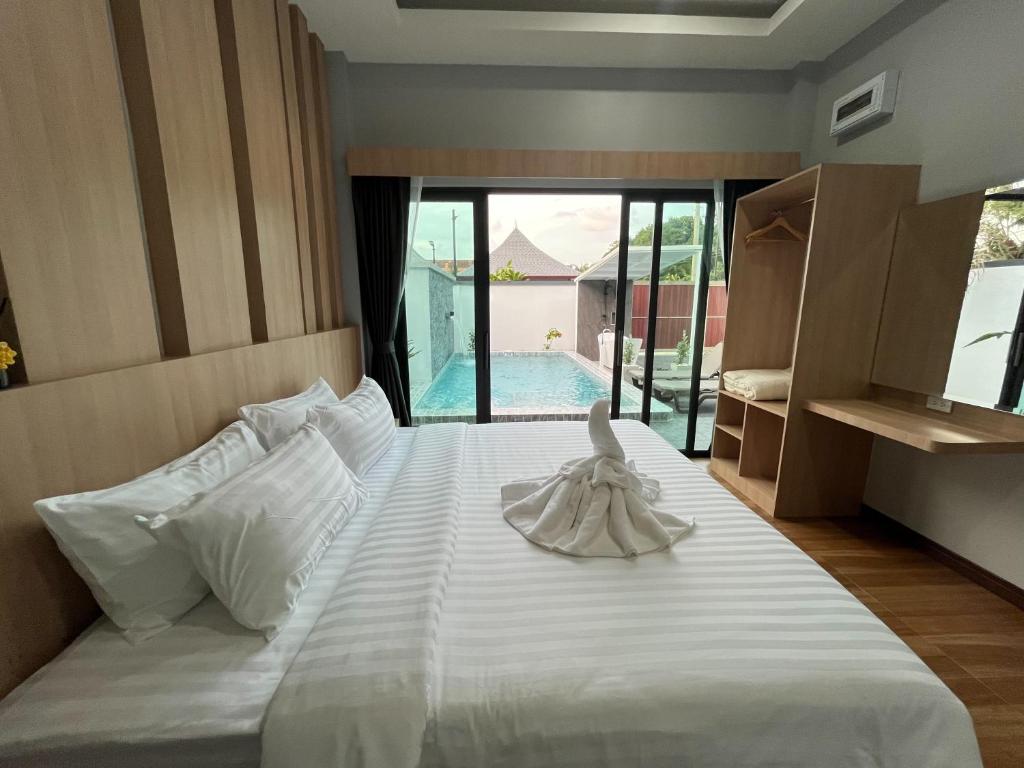 Postel nebo postele na pokoji v ubytování The M Millions Pool Villa, Aonang Krabi -Free Shuttle to Aonang Beach