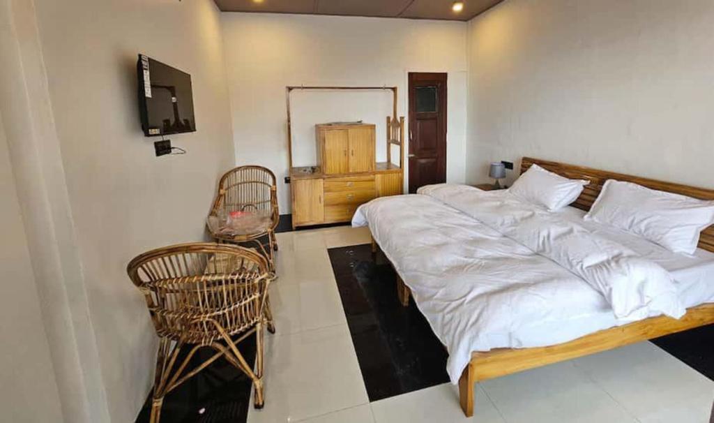 Postel nebo postele na pokoji v ubytování Nishantam Boho Mussoorie