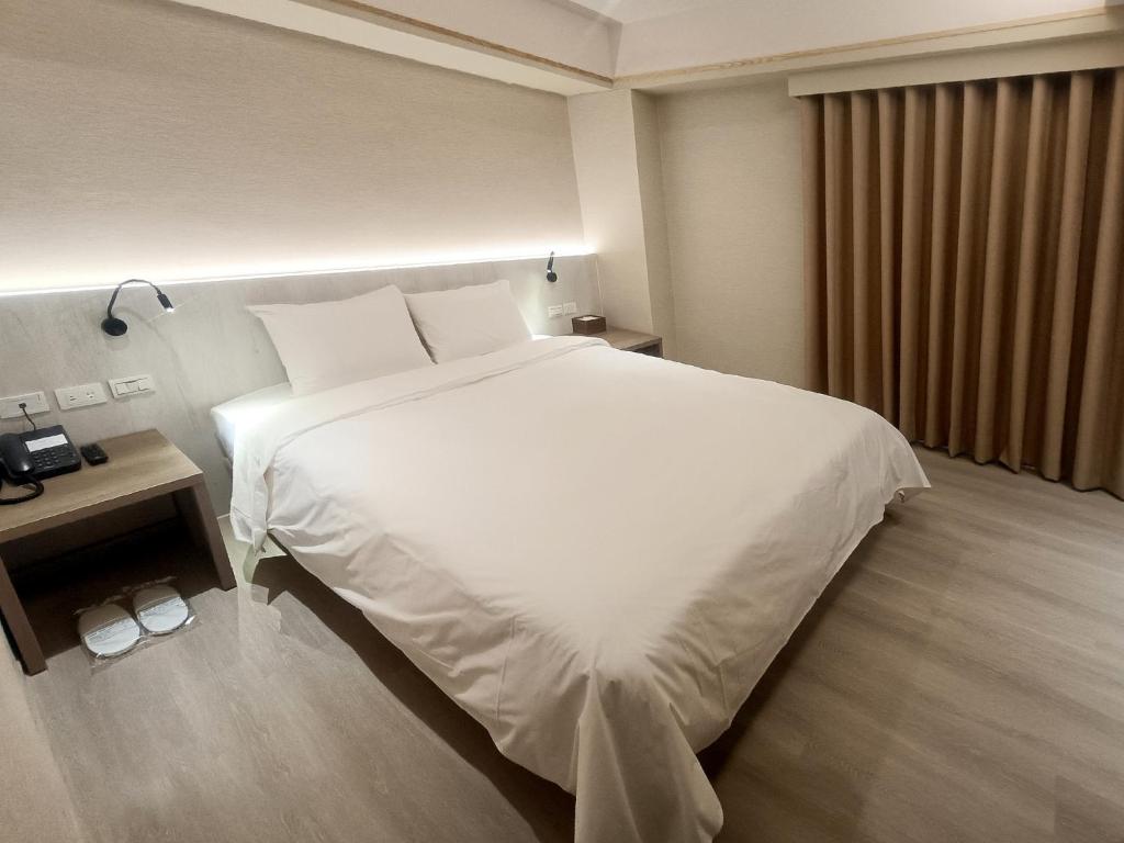 Postel nebo postele na pokoji v ubytování 衿后禾居Good Hotel