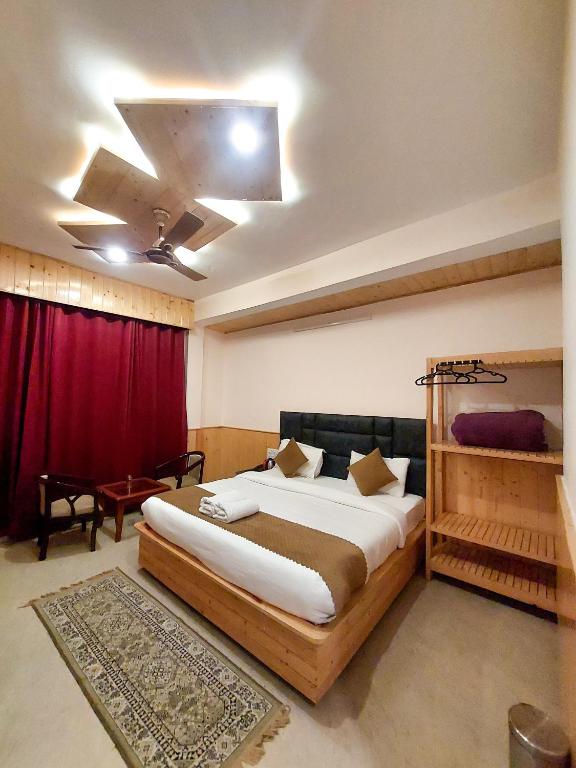 Postel nebo postele na pokoji v ubytování Hotel Cloud Height