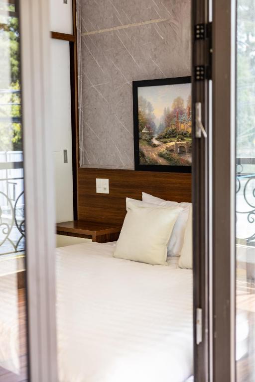 Postel nebo postele na pokoji v ubytování Phương Trinh Hotel