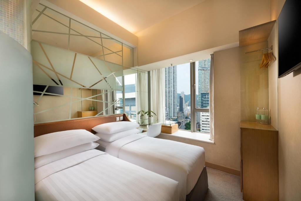 Postel nebo postele na pokoji v ubytování Dorsett Mongkok, Hong Kong
