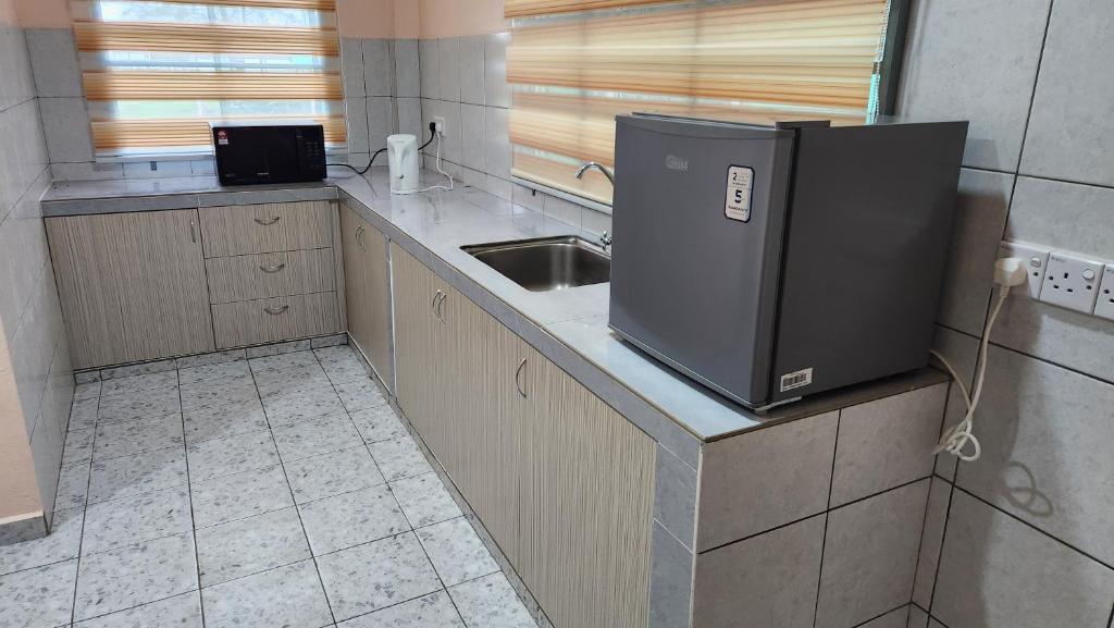 Kuchyň nebo kuchyňský kout v ubytování Kelambu Beach Villa