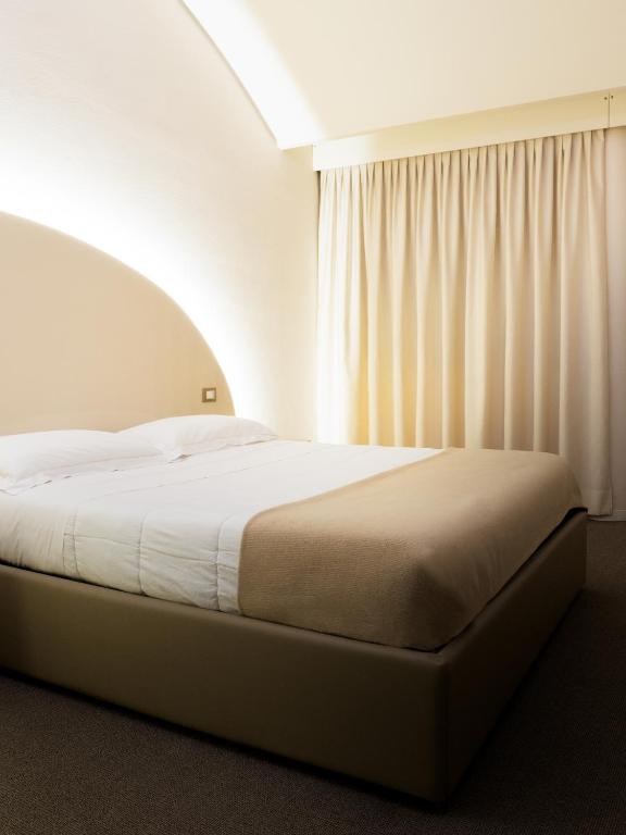 Postel nebo postele na pokoji v ubytování Dealuna Motel