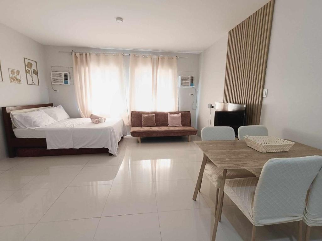 Postel nebo postele na pokoji v ubytování Olvera Residences