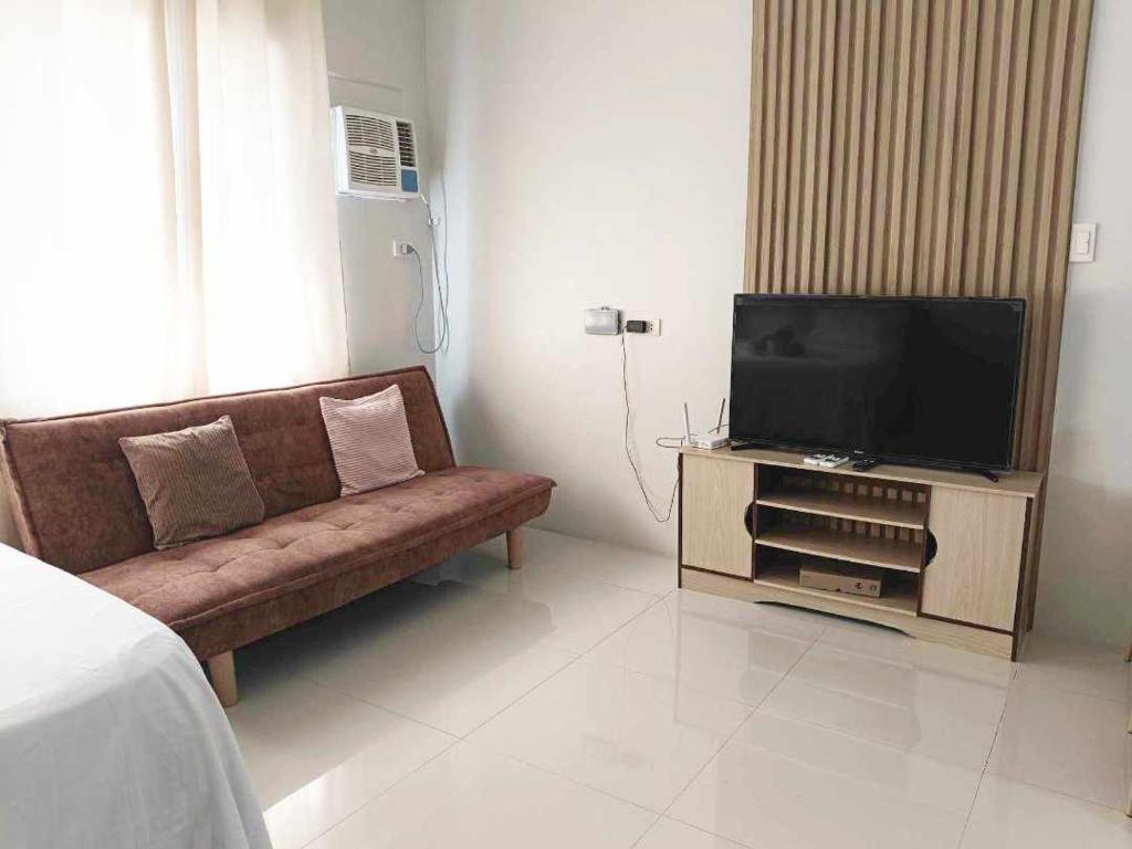 TV a/nebo společenská místnost v ubytování Olvera Residences