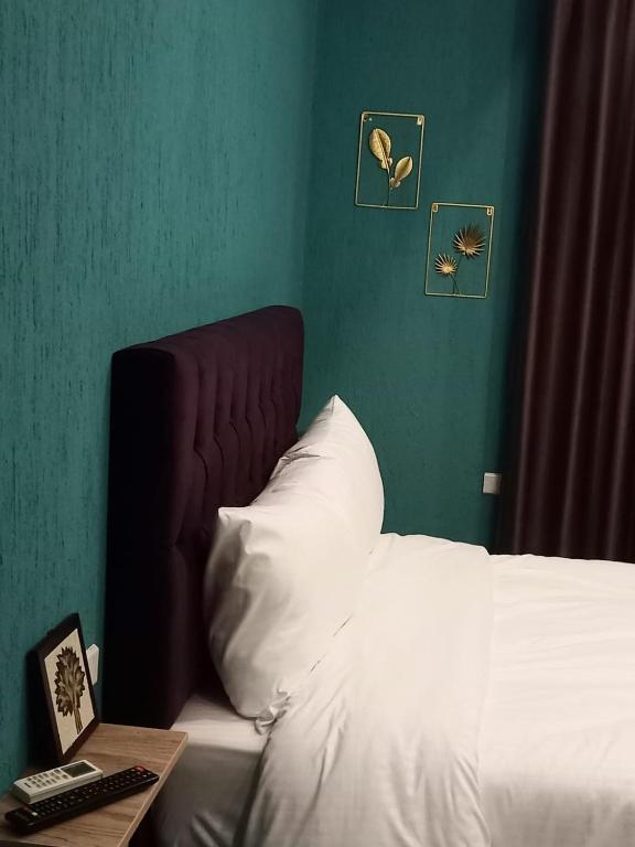 Postel nebo postele na pokoji v ubytování Blue Stone H