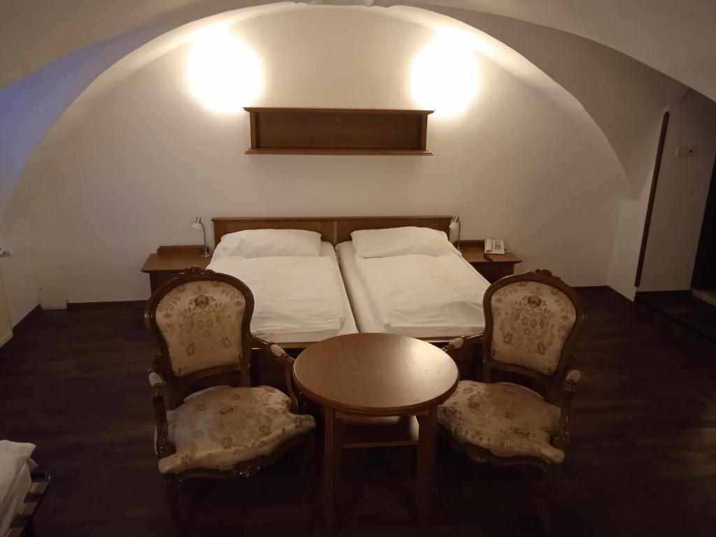 Letto o letti in una camera di Rožmberský dvůr