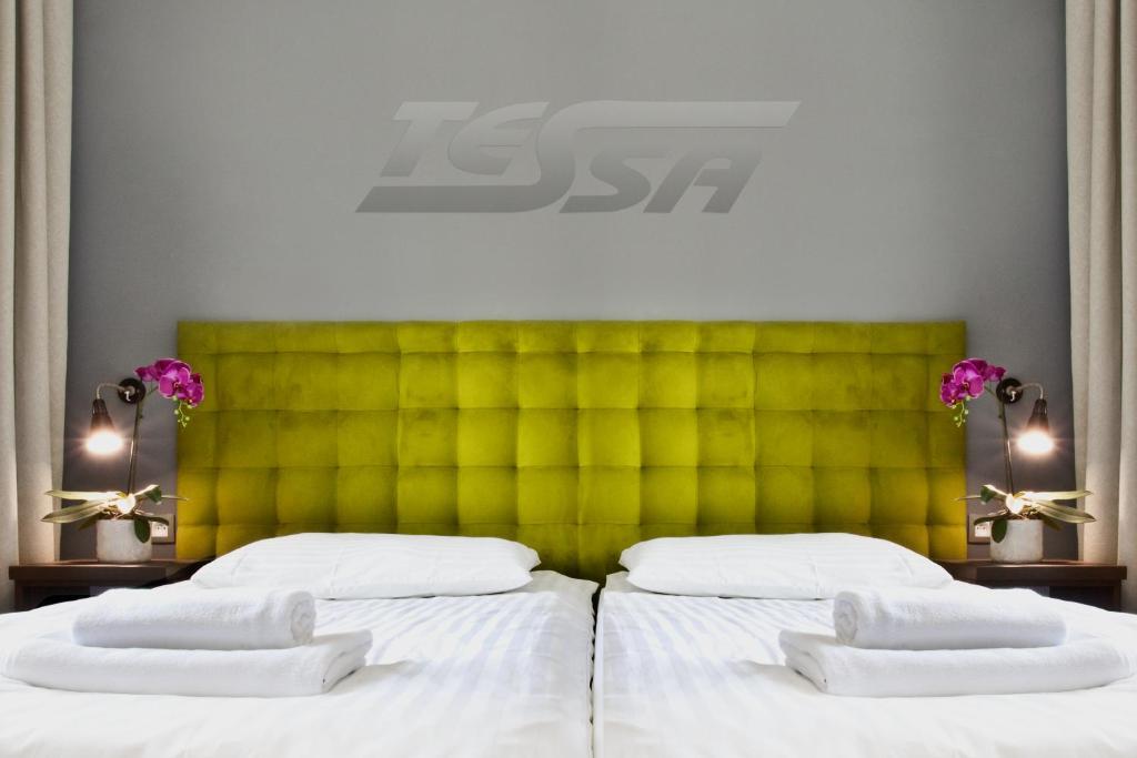 Ένα ή περισσότερα κρεβάτια σε δωμάτιο στο Pokoje Gościnne Tessa