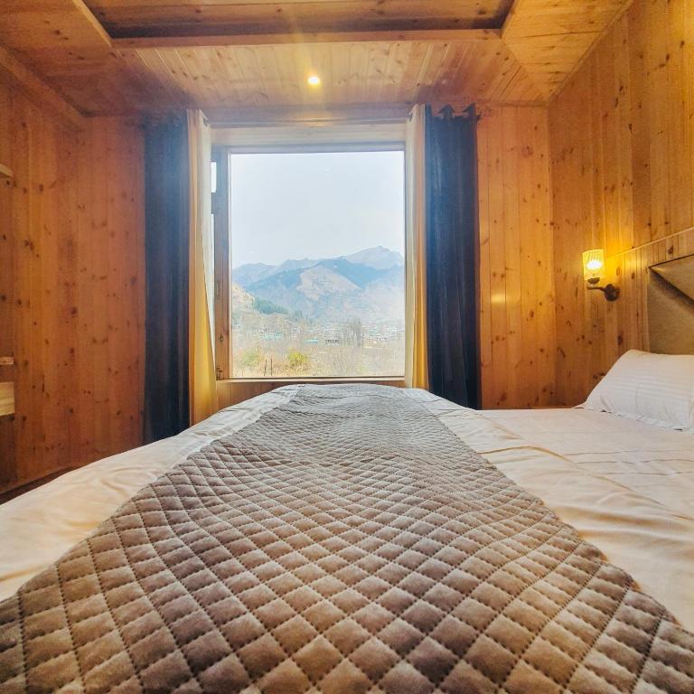 Postel nebo postele na pokoji v ubytování Ekaant Stays - Manali
