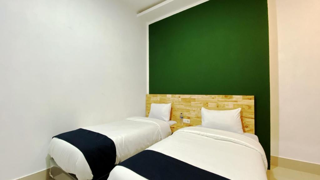 Postel nebo postele na pokoji v ubytování D'Hills Hotel