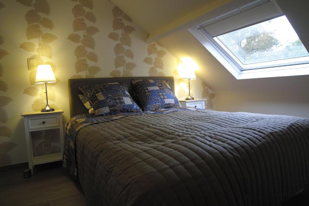 Postel nebo postele na pokoji v ubytování Bed & Breakfast De Kleine Magnolia