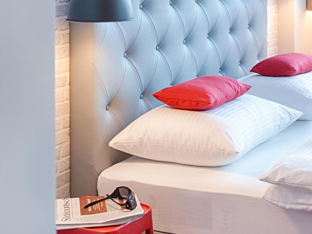 Postel nebo postele na pokoji v ubytování MLOFT Apartments München
