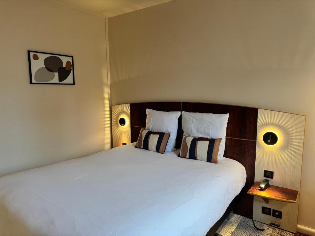 Postel nebo postele na pokoji v ubytování Mercure Besancon Parc Micaud - Hotel & Bar