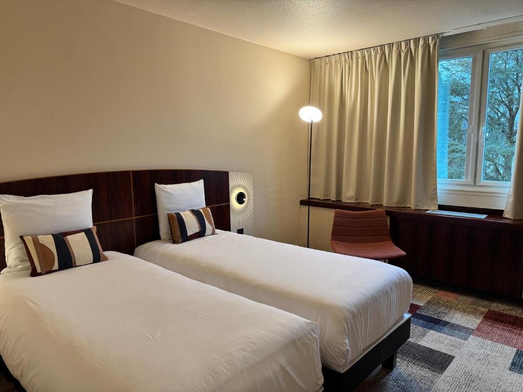 Postel nebo postele na pokoji v ubytování Mercure Besancon Parc Micaud - Hotel & Bar