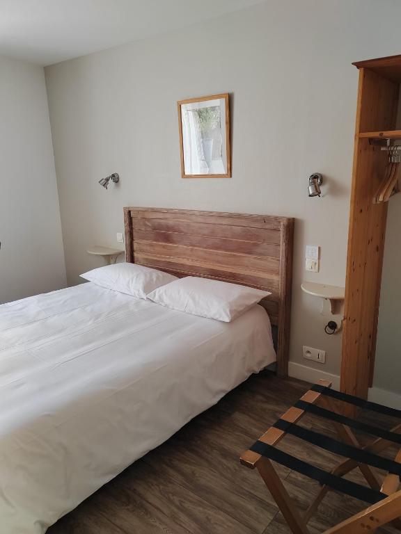 Postel nebo postele na pokoji v ubytování Hôtel l'Acadien