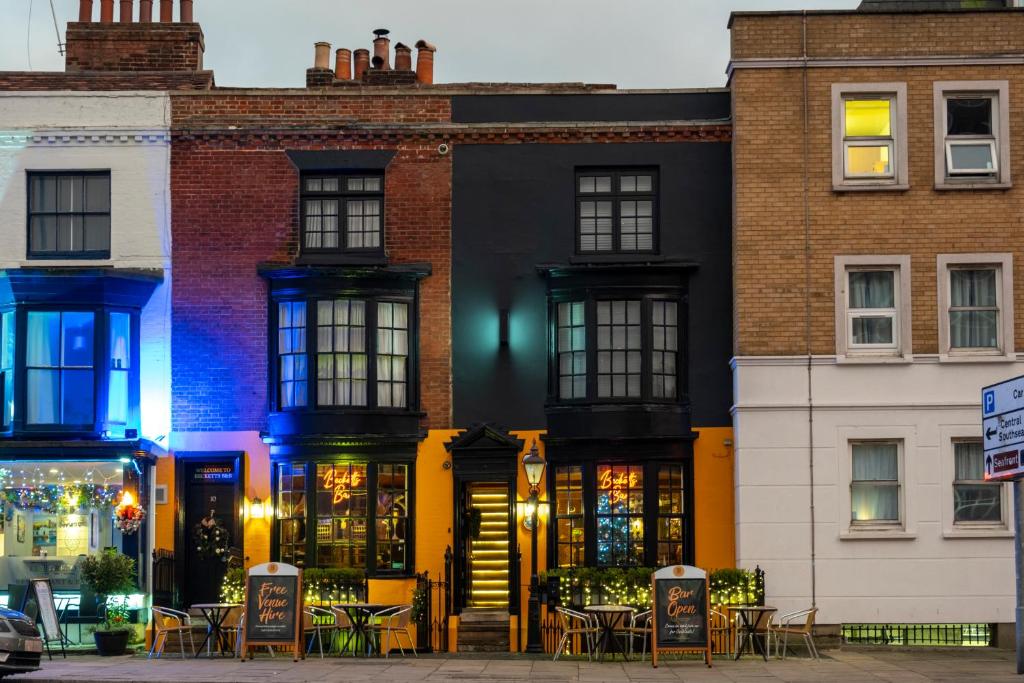 a building with tables and chairs in front of it at Becketts Townhouse in Portsmouth