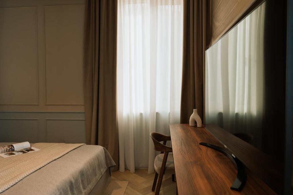 Postel nebo postele na pokoji v ubytování Parc Suites by Hotel Cerbul