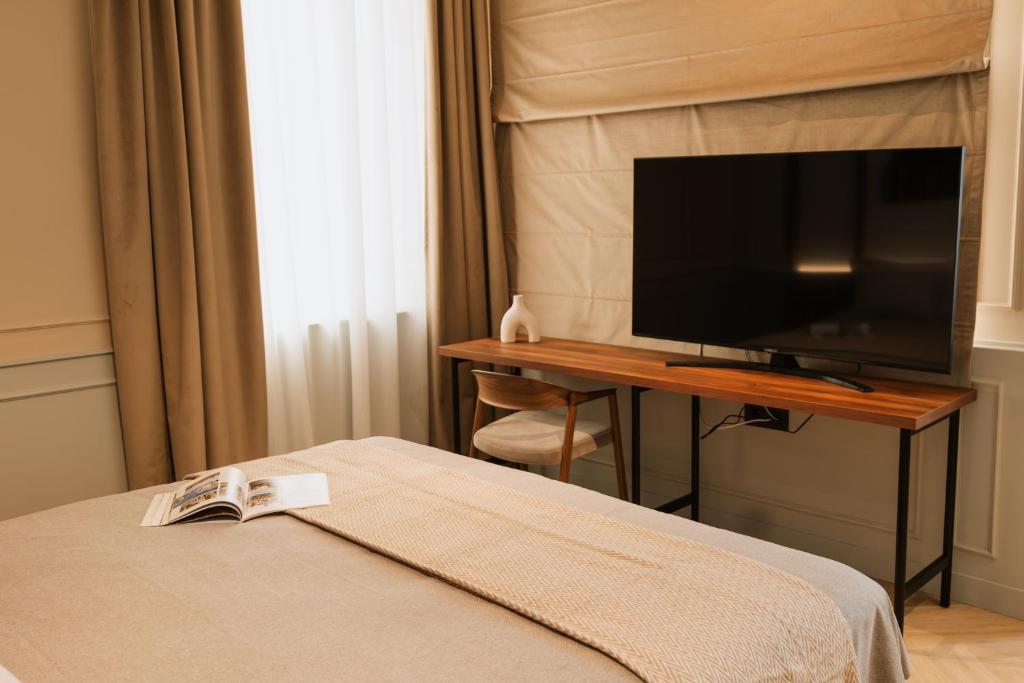 Postel nebo postele na pokoji v ubytování Parc Suites by Hotel Cerbul