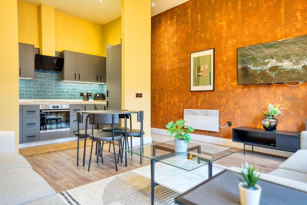 a living room with a couch and a table at Spacious Central Station 2 Bed Apartment B3 in Glasgow