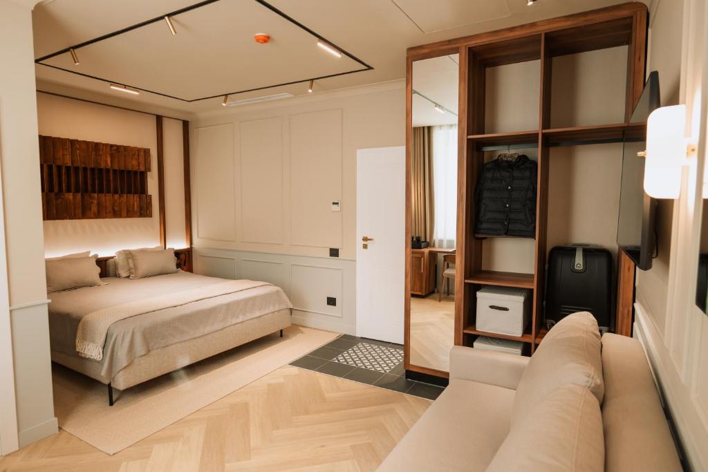 Postel nebo postele na pokoji v ubytování Parc Suites by Hotel Cerbul