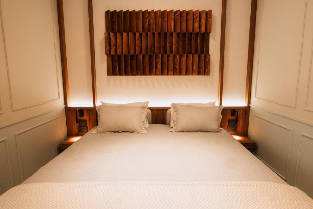 Postel nebo postele na pokoji v ubytování Parc Suites by Hotel Cerbul