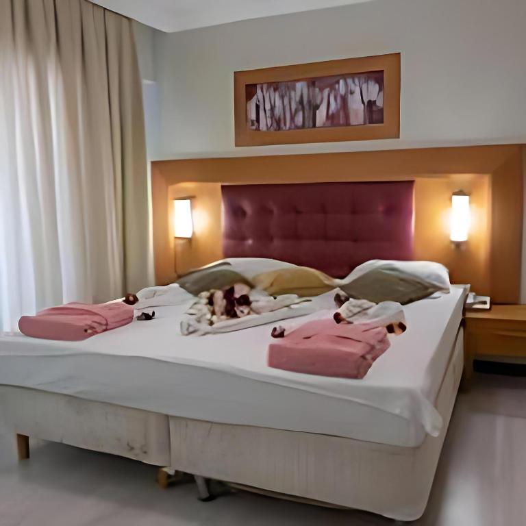Postel nebo postele na pokoji v ubytování Scylax Hotels Mahmutlar
