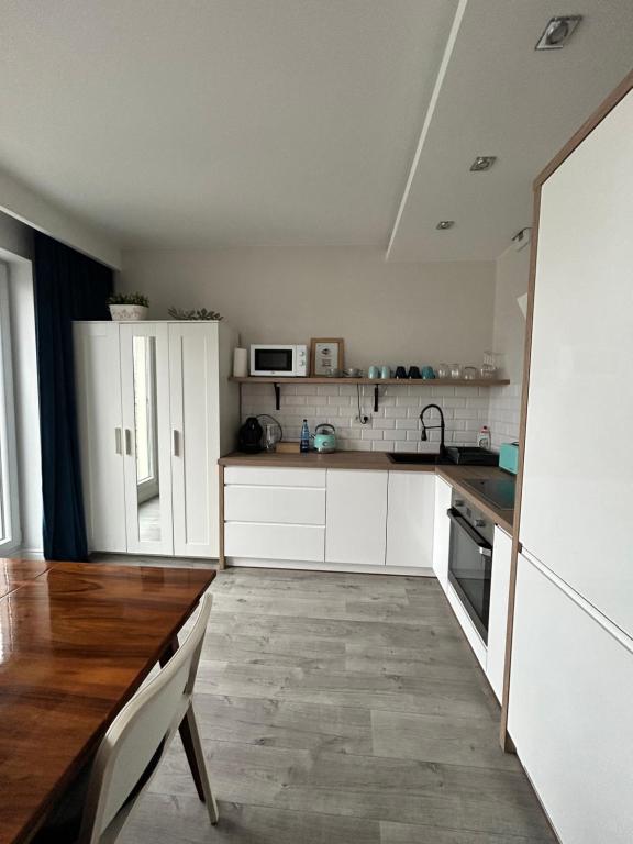 Kuchyňa alebo kuchynka v ubytovaní Apartament City Centre 108